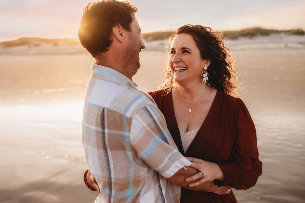 Couple embraces each other during Family Portrait Session on Kiawah Island with Holy City Family Photography.