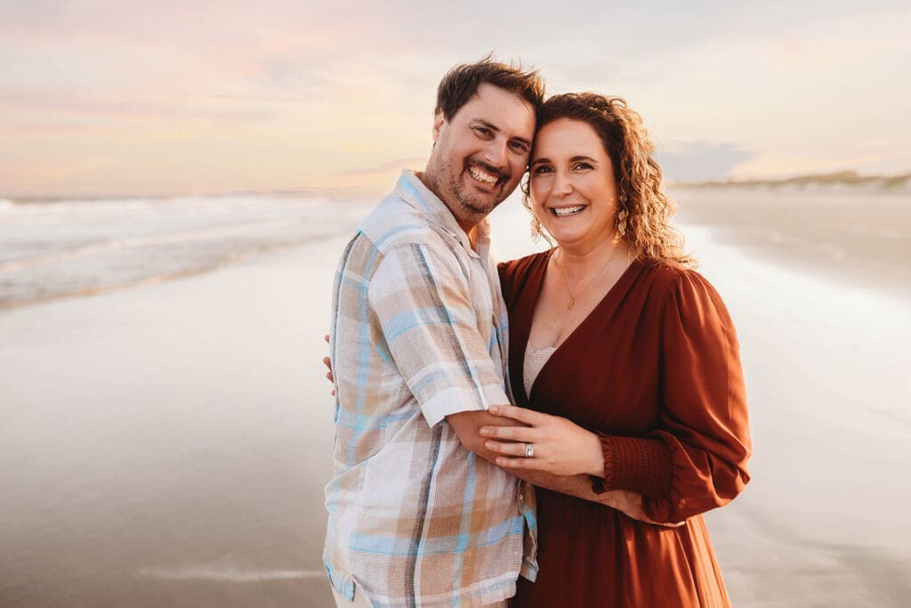 Couple embraces each other during Family Portrait Session on Kiawah Island with Holy City Family Photography.
