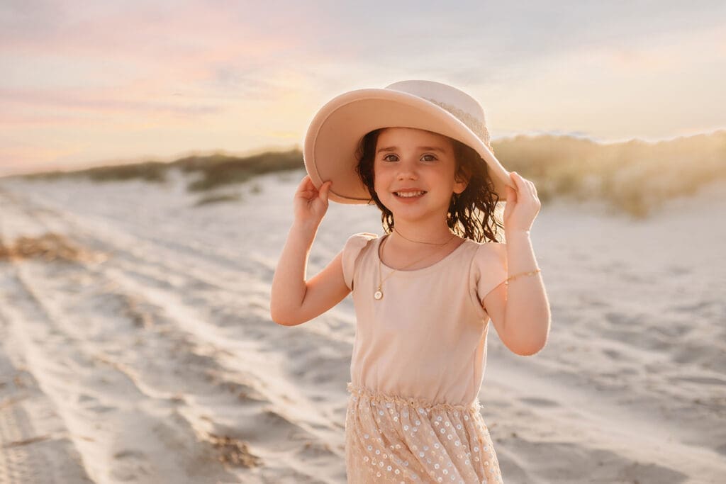 Little girl smiles at the camera during Family Portrait Session on Kiawah Island with Holy City Family Photography.