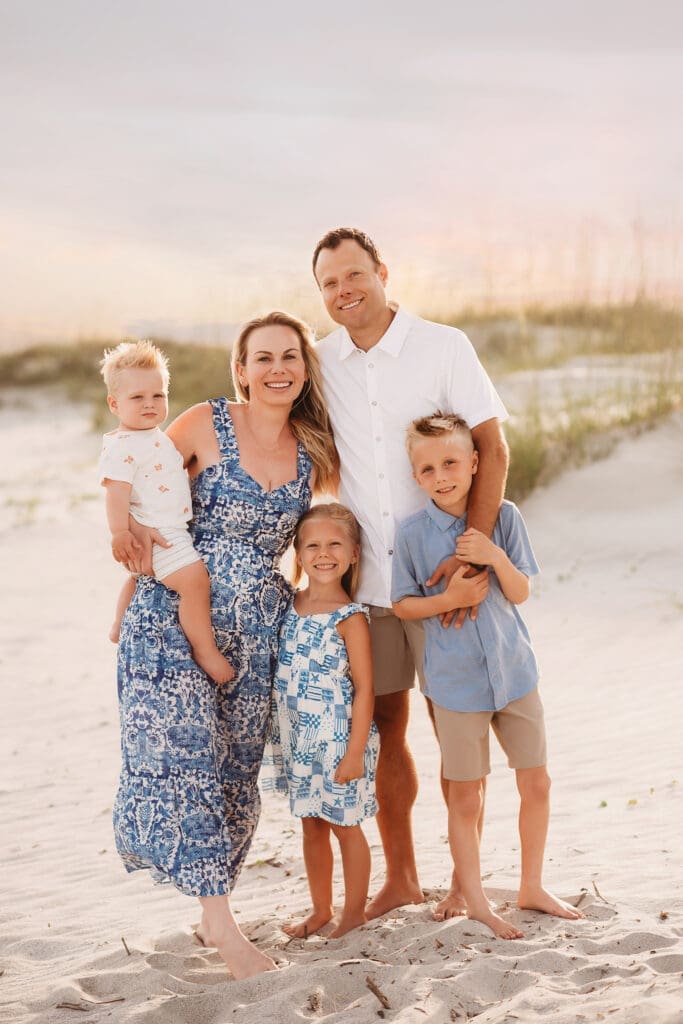 Family poses for Beach Photos with Isle of Palms Beach Photographer, Holy City Family Photography in Charleston, SC.