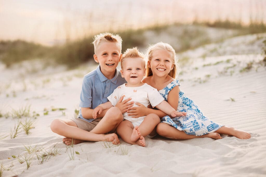 Children pose for Family Pictures on Isle of Palms Beach during Family Portrait Session with Isle of Palms Beach Photographer, Holy City Family Photography in Charleston, SC.