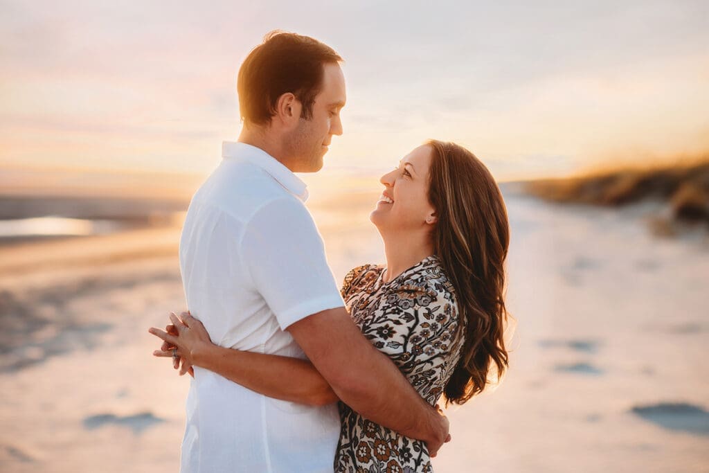 Parents embrace during Family Photos on Kiawah Island after reading about the Best Restaurants on Kiawah Island with Kids on Holy City Families Blog! 